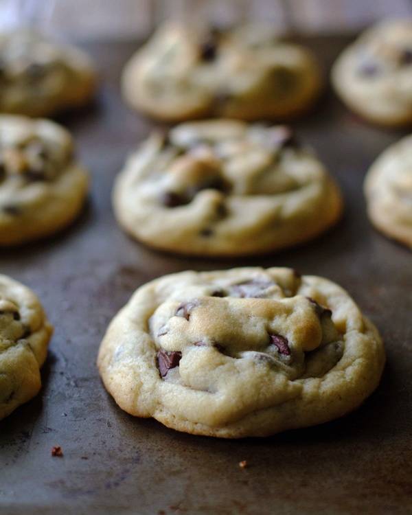 Chocolate chip cookies on a baking pan.
