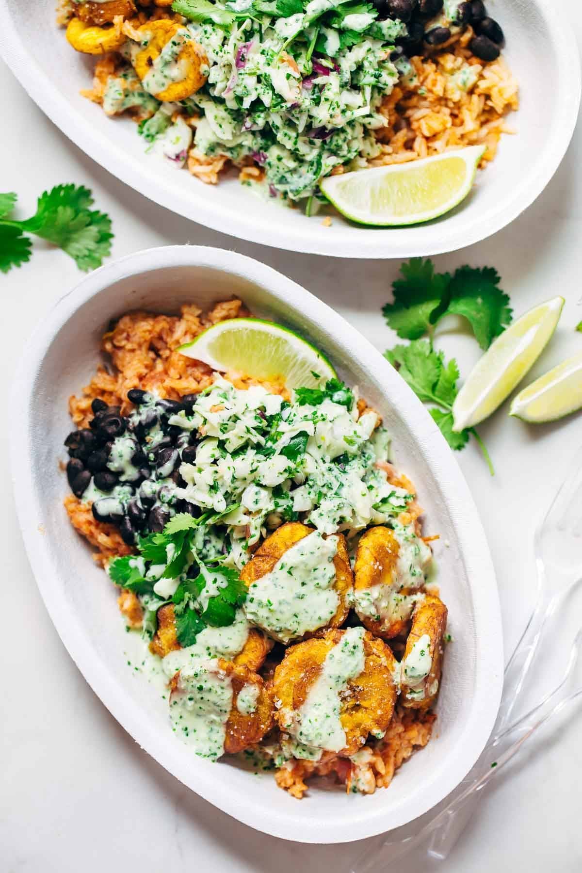 Spicy Brazilian Burrito Bowls recipe featuring seasoned rice and beans, garlic cilantro lime slaw, and crispy fried plantains. So good // almost vegan. | pinchofyum.com Spicy Brazilian Burrito Bowls recipe featuring seasoned rice and beans, garlic cilantro lime slaw, and crispy fried plantains. So good // almost vegan. | pinchofyum.com