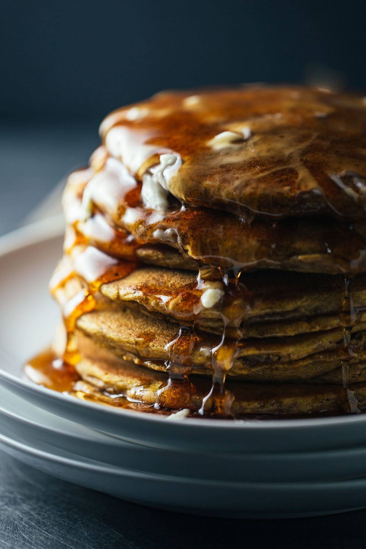 Cinnamon Pumpkin Pancakes with syrup.